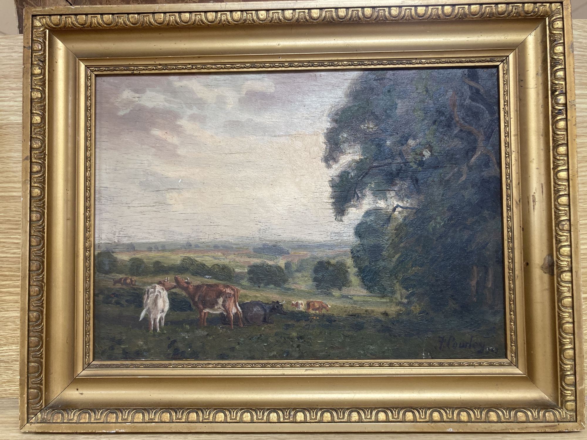 Frank Cowley (Exh.1909-1914), oil on board, Cattle in a landscape, signed, 24 x 34cm